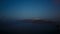 Greek Santorini Caldera Timelapse from Night to Dawn Showing Stars and Boats
