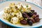 Greek style salad - feta cheese and kalamata olives on wooden table