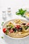 Greek style vegan mediterranean hummus with fresh vegetables, olives, olive oil and feta cheese