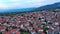 Greek town of Litochoro with small houses against the backdrop of the Mount Olympus and a cloudy sky