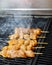 Greek traditional chicken meat souvlaki grilled on a barbeque fire, selective focus