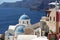 Greek traditional Orthodox Christian church in Oia village on the edge of volcano caldera of Santorini island.