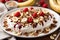 Greek yogurt banana split with peanuts and cinnamon