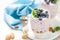 Greek yogurt or blueberry parfait with fresh berries and almond nuts on white background