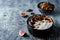Greek yogurt chocolate almond nuts oatmeal granola with figs in a bowl