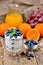 Greek yogurt with oatmeal, fresh blueberries, mint and orange juice, grapes in background vertical photo