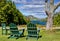 Green Adirondack Chairs Overlooking Lake in Maine