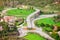 Green aerial roundabout. Aerial view of the view of the road with a circular motion. Road Signs