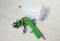 Green air compressor gun. Isolated on a wooden background