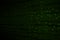 The green alphanumeric code background.