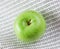Green apple on binary code