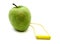 Green apple connected to a battery