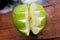 Green apple cut out decoratively / Fruits and vegetables healthy food / Carved apple on wooden background, close up