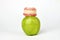 Green apple and dentures on white background