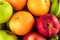 Green apple and orange and red apple and banana are mixed tasty fruit composition on  background fruit health food