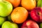 Green apple and orange and red apple and banana are mixed tasty fruit composition on  background fruit health food