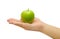Green apple on the palm in isolated background