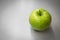 Green apple with waterdrops