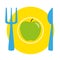 Green apple on the yellow plate with blue fork and knife