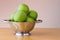 Green apples in a colander