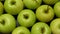 Green apples rotating, closeup. Fruits background