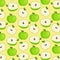 Green apples on a yellow background. Pattern, whole apples and cut