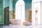 Green arched windows bathroom interior, woman