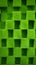 Green artificial grass cubes texture background, close-up, top view