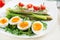 Green asparagus with boiled eggs and sandwich cream cheese