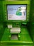 Green ATM and the inscription on the screen in Russian, `Use NFC is convenient