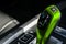 Green Automatic gear stick of a modern car. Modern car interior details. Close up view. Car detailing. Automatic transmission leve