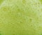 Green avocado milkshake with bubbles texture