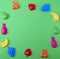 Green background with childrens colorful toys