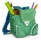 Green backpack with school supplies