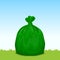 Green bag plastic garbage on grass sky background, bin bag, garbage bags for waste, pollution plastic bag waste, 3r ad, waste