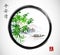 Green bamboo trees, island with mountains and fishing boat in black enso zen circle.