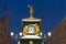 Green barometer watch with gold decor and lanterns on Malaya Konyushennaya street in St. Petersburg in the evening in