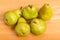 Green Bartlett Pears on Wood Table