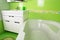 Green bathroom interior. Corner bath