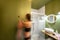 Green bathroom with woman in underwear