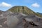 Green Batok mountain and ash sand dunes of Bromo.