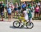 Green Bay Packer Player Riding Bike with Young Fan