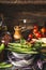 Green beans pods cooking ingredients in bows on rustic kitchen table