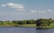 Green beautiful island in the center of a lake in Summer