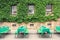 Green beer tables with benches in front of a green facade in Wittenberg Krofdorf-Gleiberg