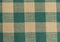 Green and beige checkered cloth.