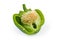 Green bell pepper cut in half with seeds inside