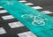 Green bicycle lane markings across the road