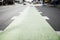 Green bicycle lane painted in street