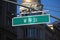 Green big West 19th Street sign hanging on a arch pole in the streets of midtown Manhattan